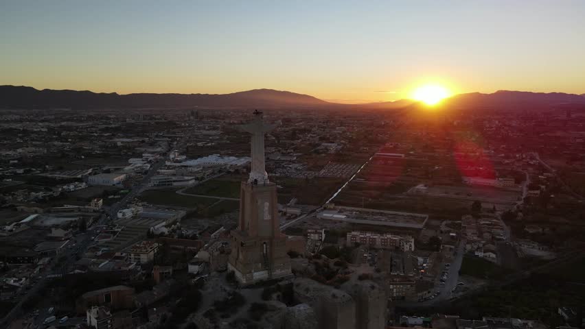 sunset in Murcia with the Christ of Monteagudo