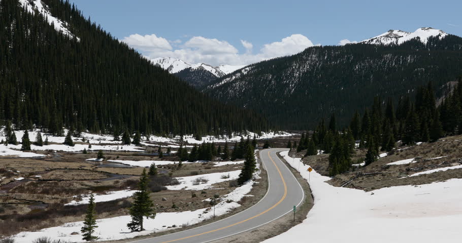 Traffic Rocky Mountain valley canyon road Colorado. Independence Pass Rocky Mountains Colorado at elevation 12,095 ft on Continental Divide. Scenic overlook alpine environment.