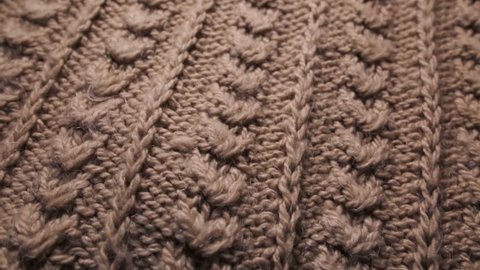 Synthetic fibers of knitted winter sweater. Can be used as background. Closeup shot.