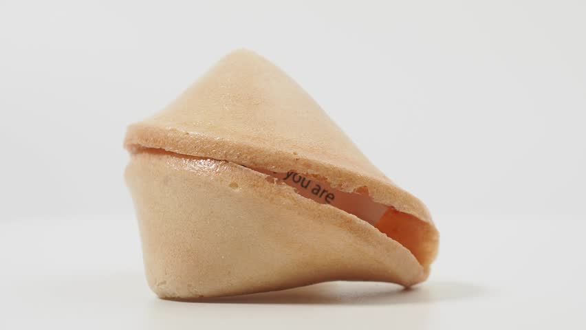 Fortune cookies rotate on a white background. Fortune cookies close up.