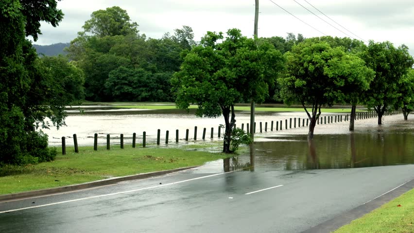 Flood waters from a heavy thunderstorm flowing across a dual carriageway road on the Gold Coast in Queensland, Australia.