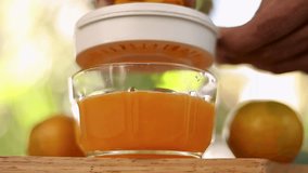 Close-up shot of making orange juice Homemade orange juice Natural orange juice, vitamins,manual blenders
