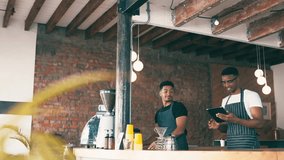 High five, tablet and young baristas in coffee shop for celebration, success and achievement. Happy, digital technology and men business owners with celebrating hand gesture in cafe or restaurant. - Powered by Shutterstock - Get 15% off with code: PIKWIZARD15