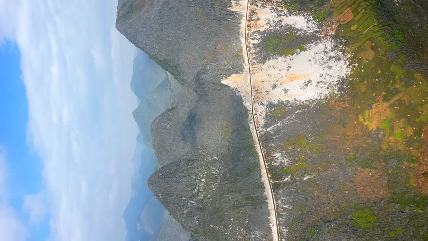 Vertical video. Scenic mountain road on the Ha Giang Loop, North Vietnam.