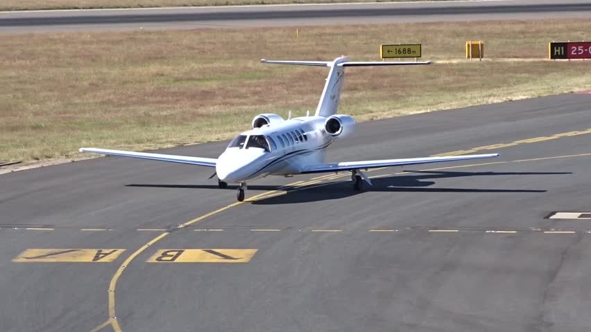 Generic White Private Jet Taxiing at Airport after Landing