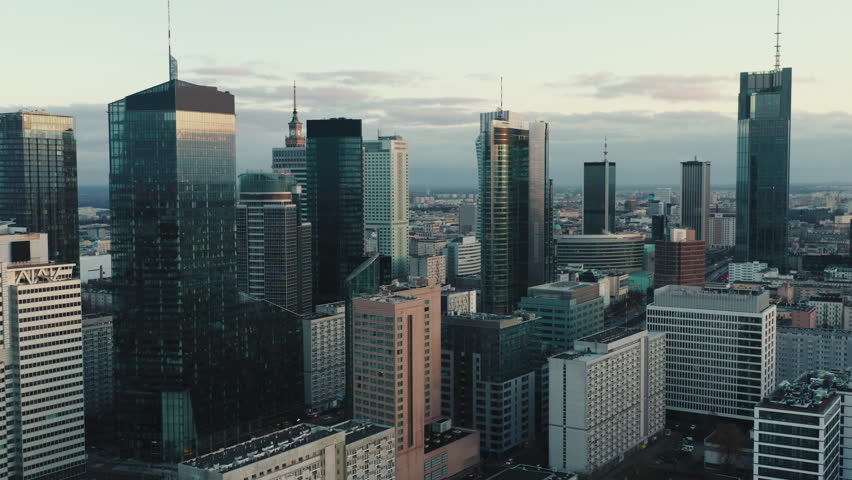 Aerial panorama of downtown glass skyscrapers. Cinematic drone shot morning cityscape skyline, high-rise modern architecture buildings, big city financial district, no logos and advertising billboards