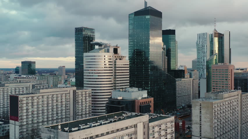 Aerial panorama of downtown glass skyscrapers. Cinematic drone shot morning cityscape skyline, high-rise modern architecture buildings, big city financial district, no logos and advertising billboards Royalty-Free Stock Footage #3410900681