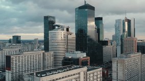 Aerial panorama of downtown glass skyscrapers. Cinematic drone shot morning cityscape skyline, high-rise modern architecture buildings, big city financial district, no logos and advertising billboards - Powered by Shutterstock - Get 15% off with code: PIKWIZARD15