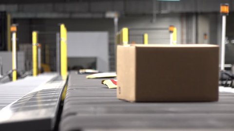 Huge amount of parcels bein transported on conveyor belt system