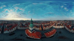 Embark on a captivating journey through the heart of Jelenia Gora, Poland, as this 360-degree aerial video takes you soaring above the historic town square. Marvel at the stunning architecture of the