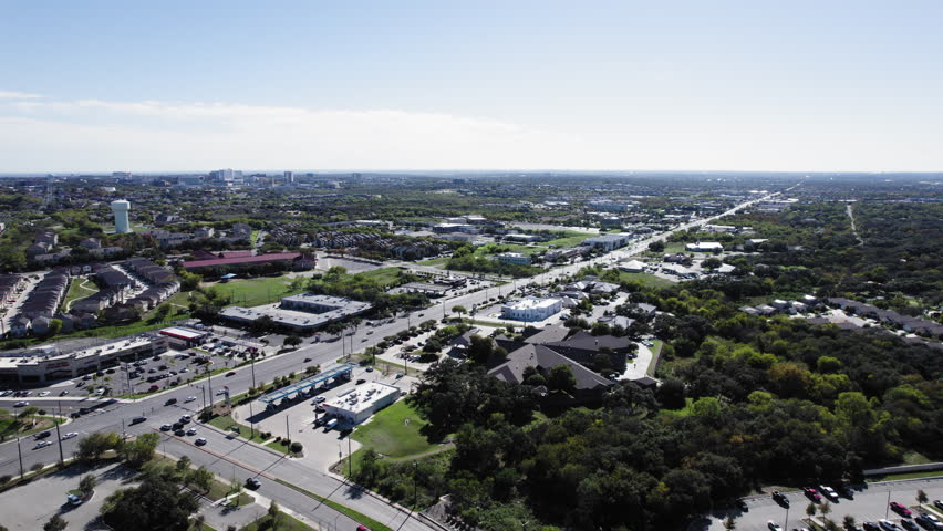 Aerial shot over Huebner Road in San Antonio, Texas, traffic, dolly backwards