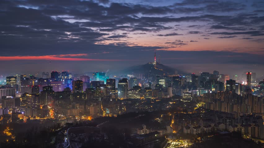 Seoul city skyline landscape View of Seoul Tower and modern buildings in the morning with beautiful clouds passing by during sunrise. Seoul. Landmark of South Korea.