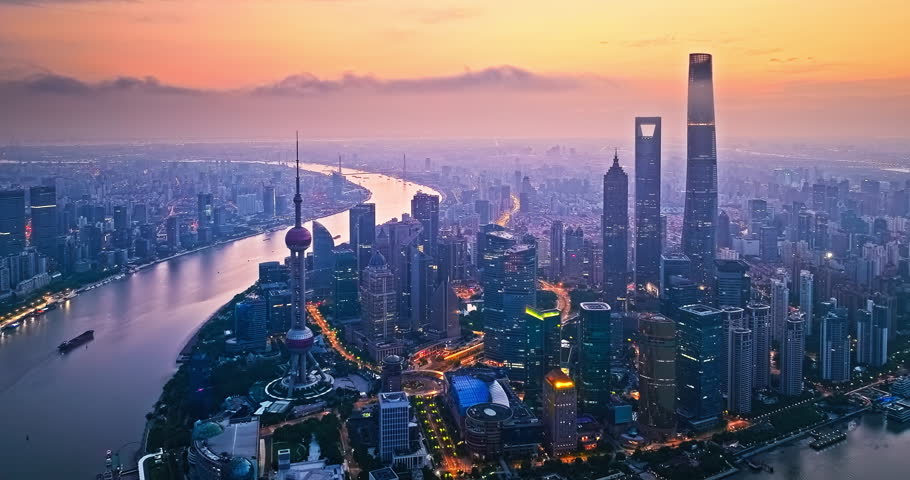 Aerial shot of Shanghai downtown buildings skyline and river at night
