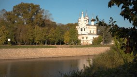 An ancient Christian church on the river bank in the ancient Russian city of Vologda. Adapted for travel, urban, and Christian content.