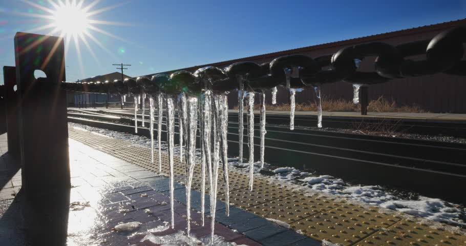 This is a shot of some Icicles hanging off some chain by the train tracks