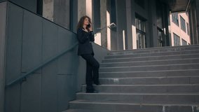 Caucasian businesswoman real estate agent manager employer talk smartphone in city near office building smiling happy woman girl university student talking mobile call speak phone outdoors full length - Powered by Shutterstock - Get 15% off with code: PIKWIZARD15