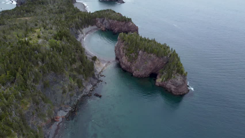 Overcast day in Newfoundland, Canada. Mountain cliffs. Sea side.