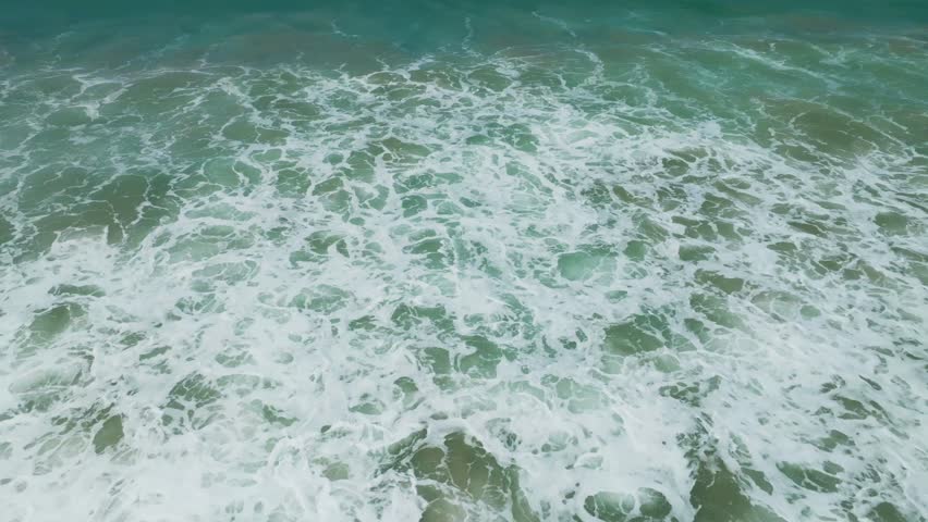 Amazing waves crashing on sandy shore,Beautiful sea waves background,Beach sea summer season background