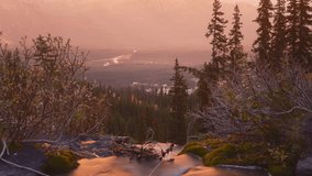 Misty sunrise over tranquil mountainous landscape with glowing sun, trees and waterfall. - Powered by Shutterstock - Get 15% off with code: PIKWIZARD15