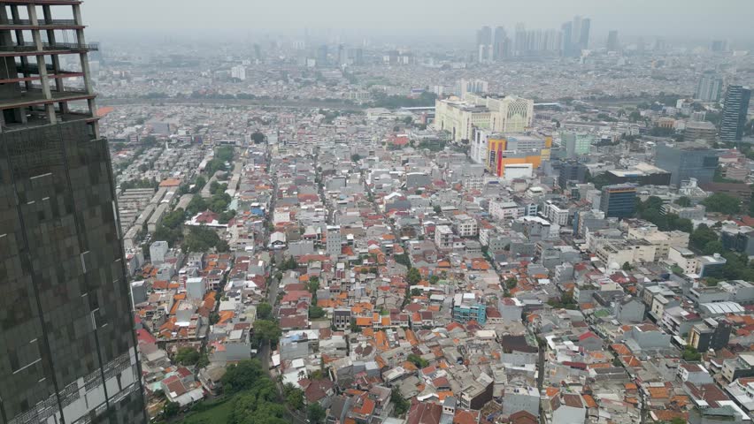 aerial view from above of a densely populated residential neighborhood in Central Jakarta