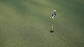 Smooth movement of golf ball hole and flag