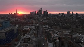 Dramatic Moody Sunset, Aerial View Shot of London UK, United Kingdom, day, Square Mile, Heart of the City of London, Shard, Whitechapel, track back low