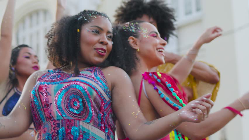 Carnival Joy in Brazil: Women Dancing with Delight at Street Festivity, Colorful Attire and Happy Faces in Brazilian Celebration. Royalty-Free Stock Footage #3412127071