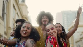 Carnival fun: Cheerful Friends Dancing Together, Festive Street Party in Brazil with Colorful Costumes and Smiling Faces. - Powered by Shutterstock - Get 15% off with code: PIKWIZARD15