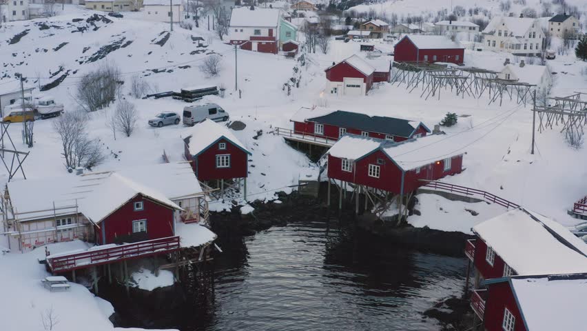 evening view of famous traditional multicolored wooden fishing houses rorbu on a sea shore at Lofoten archipelago, nothern Norway
