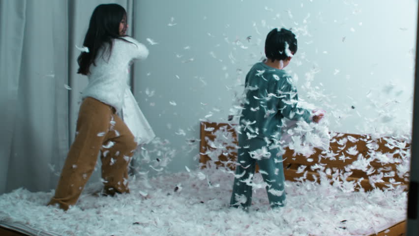 Pillow Fight Excitement - Sister Battling Small Brother, Feathers Flying in Speed Ramp Slow Motion at 1000 FPS