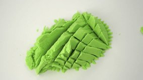 Very Satisfying and Relaxing Kinetic Sand ASMR. Cutting anti stress macro close up colorful Kinetic Sand with a Knife. Concept tik tok.