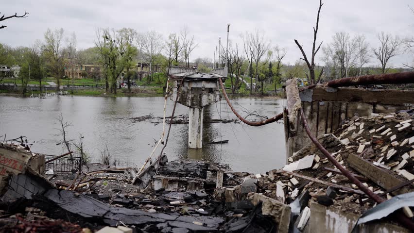 A damaged, destroyed and burned bridge in the Ukrainian city of Svyatogorsk near Donetsk in eastern Ukraine. Ruins during the war between Russia and Ukraine. The city's infrastructure was destroyed by Royalty-Free Stock Footage #3412432949
