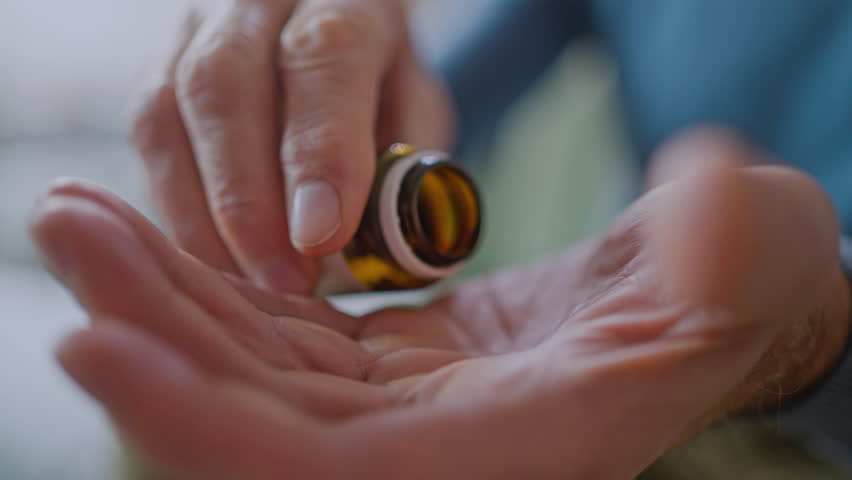 Hands with pills. Senior man hands holding medical pill. Mature old senior grandfather taking medication cure pills vitamin. Age prescription medicine healthcare therapy concept