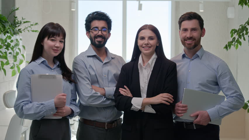 Happy team group business people diverse office coworkers looking at camera smiling posing together crossed hands for corporate portrait leadership successful professional businessmen businesswomen Royalty-Free Stock Footage #3412470253