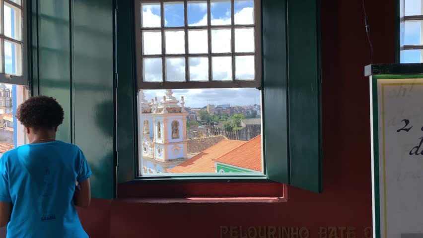 A view of Pelourinho through a Jorge Amado's House Foundation window in Salvador, Bahia - Brazil Royalty-Free Stock Footage #3412577171