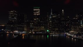 Beautiful shining New York cityscape illuminated with lights on high skyscrapers in evening dusk, aerial scenery view of developed urban infrastructure and urban contemporary architecture - Powered by Shutterstock - Get 15% off with code: PIKWIZARD15