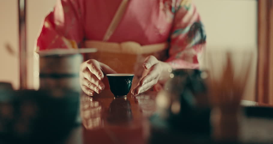 Culture, drinking and Japanese woman with tea with traditional leaves, recipe and indigenous herbs in home. Health, ceremony and person with herbal beverage for calm, wellness and detox for ritual