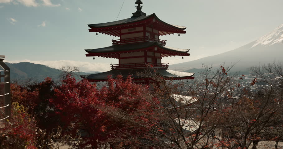 Shinto temple, building and trees in nature for religion, faith and landscape with mountains by sky background. Traditional architecture, praise and worship in environment for culture, peace and calm Royalty-Free Stock Footage #3412751789