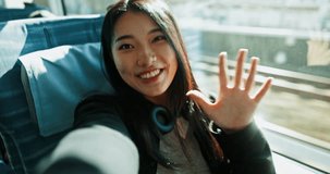 Happy asian woman, video call and train with peace sign for social media, travel or memory in public transport. Portrait of female person, face or smile while waving hand for hello on railway line