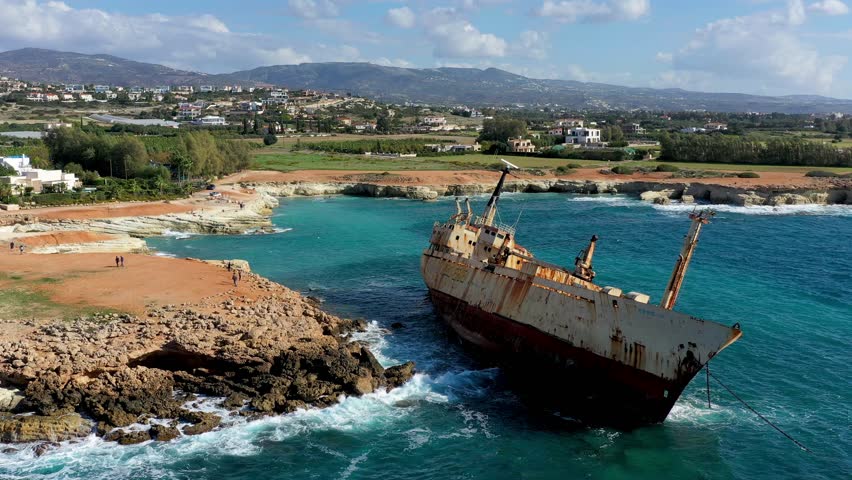 Abandoned Edro III Shipwreck at seashore of Peyia, near Paphos, Cyprus. Historic Edro III Shipwreck site on the shore of the water in Cyprus. Aerial view of Shipwreck EDRO III, Pegeia, Paphos.