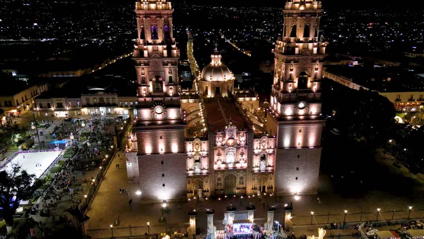 Historic center of the city of Morelia, in Mexico, at night and during Christmas time. Aerial shot with drone. Morelia Cathedral from above.
