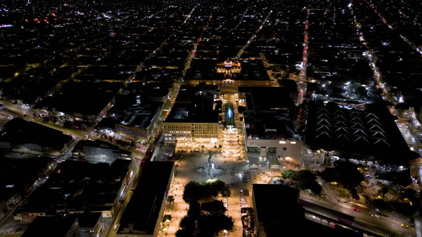 Plaza Tapatia in Guadalajara, in front of the Cabañas hospice, at night and with a drone