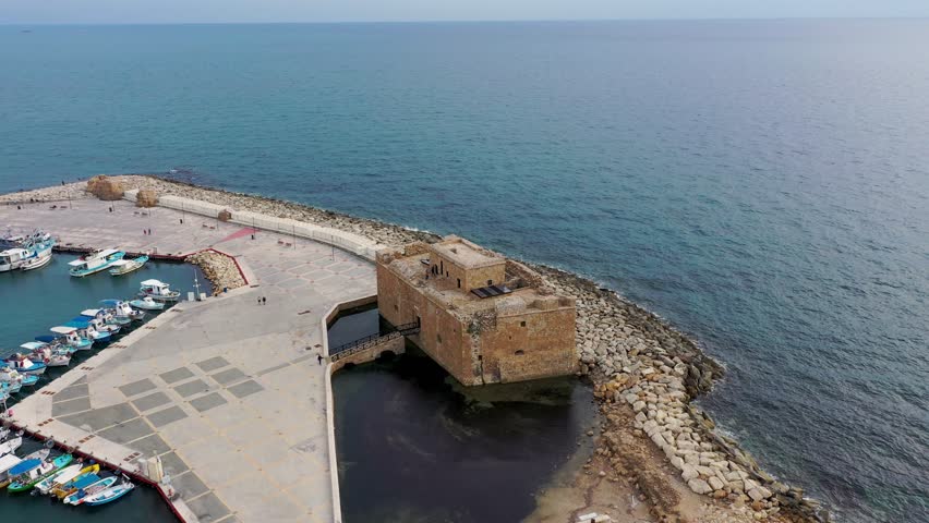 View of the town of Paphos in Cyprus. Paphos is known as the center of ancient history and culture of the island. View of embankment at Paphos Harbour, Cyprus.