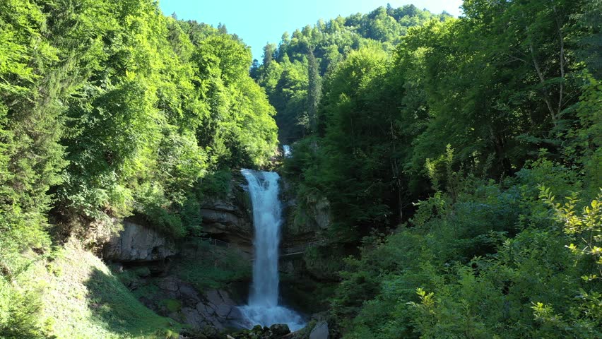 Waterfalls Giessbach in the Bernese Oberland, Switzerland. Giessbach waterfall flow to lake Brienz in Interlaken Switzerland. Giessbach Falls on Lake Brienz in the Bernese Oberland in Switzerland. Royalty-Free Stock Footage #3413079007