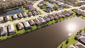 Aerial of a sunny suburban neighborhood in tropical climate - Powered by Shutterstock - Get 15% off with code: PIKWIZARD15