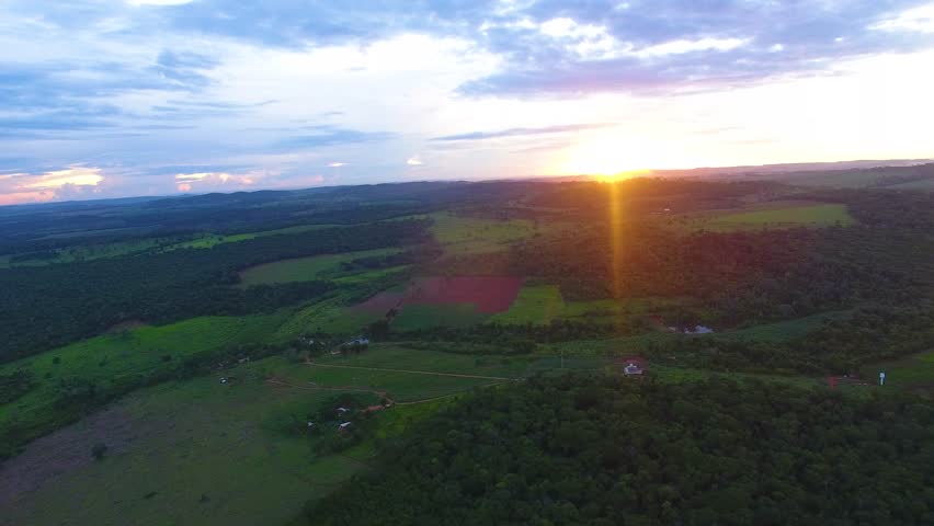 Sunset over the forest on the farm