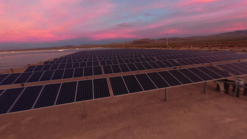 DPV Drone Flying Over Solar Panels in a Desert Solar Farm at Golden Hour Royalty-Free Stock Footage #3413148691
