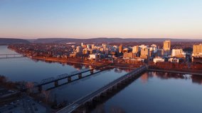 A 4k aerial video with a pull-back camera motion of the bridges leading into downtown Harrisburg Pennsylvania.