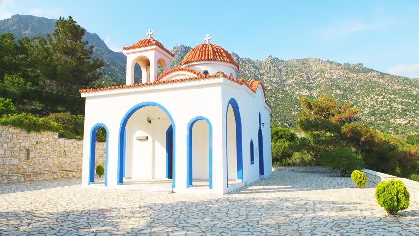 Saint Phanourios and St paraskevi small church of Greek christian orthodox religion at Magganitis, Ikaria island, Greece longevity blue zone at sunset