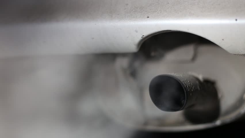 car exhaust pipe close-up with the engine running